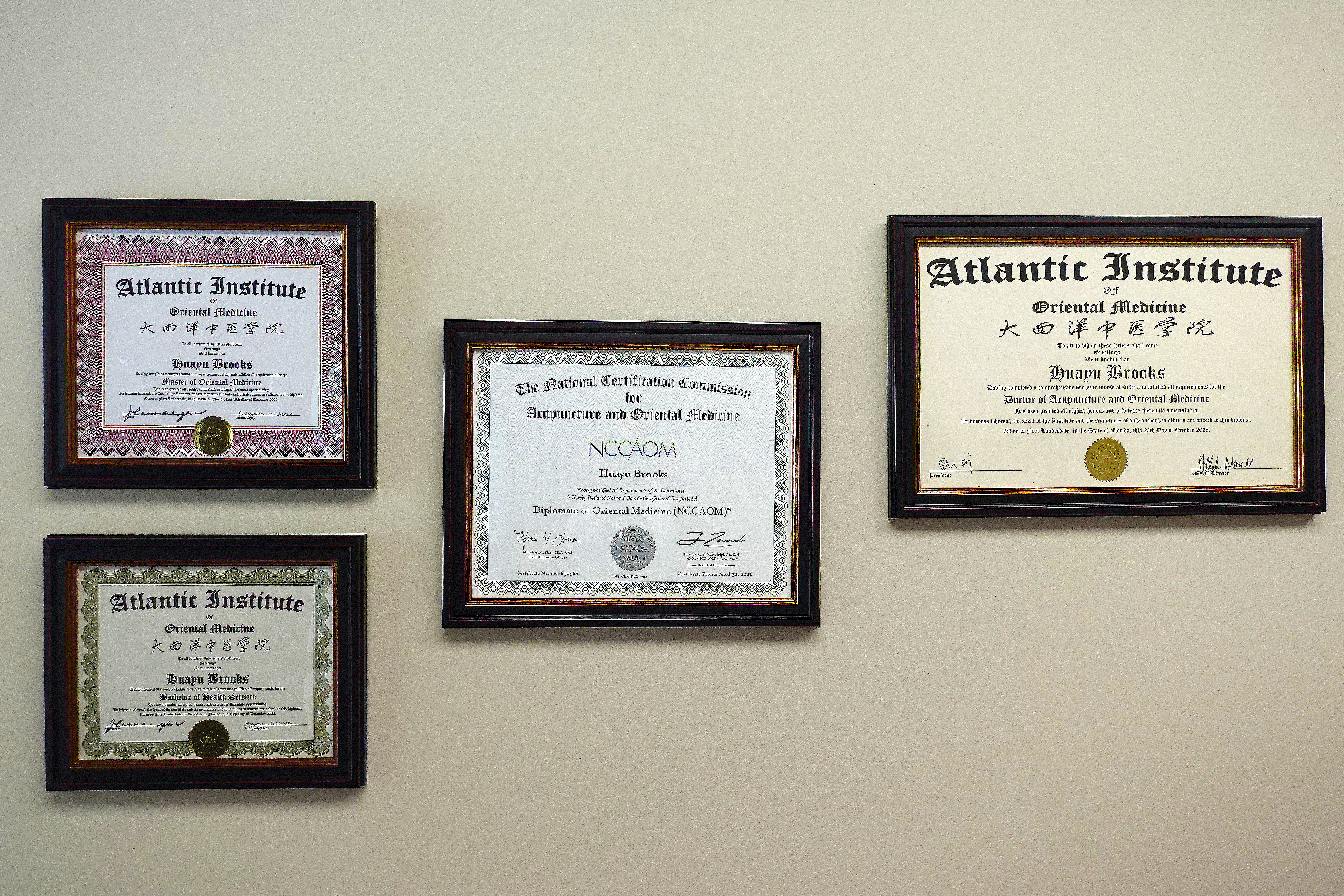 Dr. Lucy Brooks credentials displayed at South Florida TCM clinic